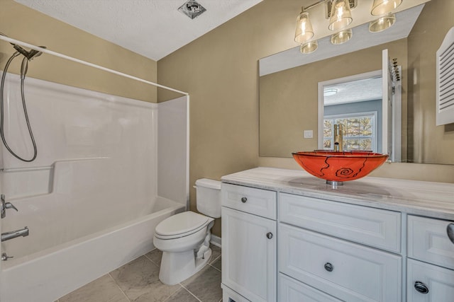 bathroom featuring tub / shower combination, a textured ceiling, toilet, and vanity