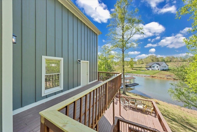 exterior space with outdoor dining space and a water view