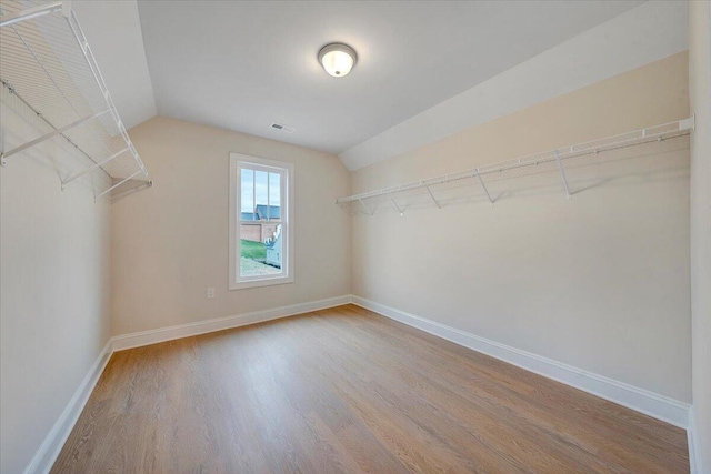 2820 Russlen Dr, Salem, VA 24153 - spacious closet featuring wood finished floors and vaulted ceiling