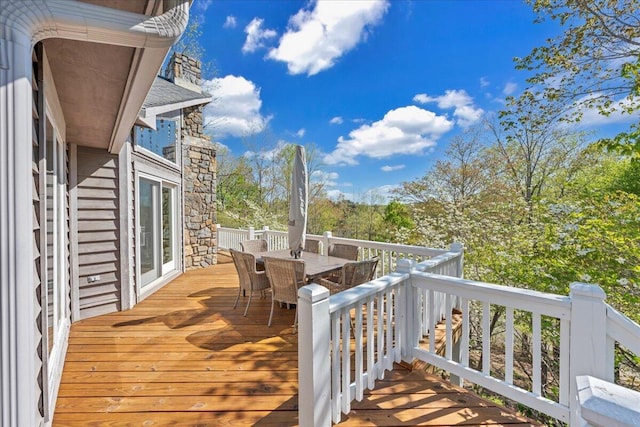 wooden deck with outdoor dining area