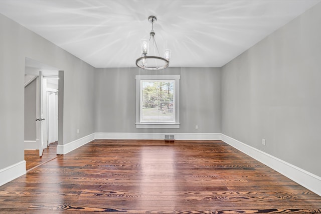319 Trinity Rd, Troutville, VA 24175 - unfurnished dining area featuring an inviting chandelier, wood finished floors, visible vents, and baseboards
