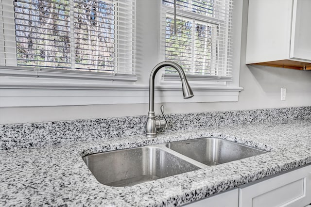 319 Trinity Rd, Troutville, VA 24175 - room details featuring light stone counters, white cabinetry, and a sink