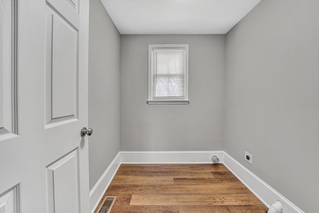 319 Trinity Rd, Troutville, VA 24175 - washroom with hookup for an electric dryer, baseboards, visible vents, wood finished floors, and laundry area