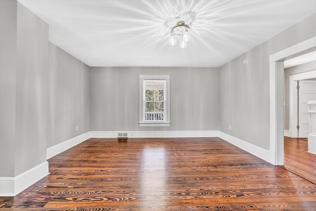 319 Trinity Rd, Troutville, VA 24175 - spare room with wood finished floors, visible vents, and baseboards