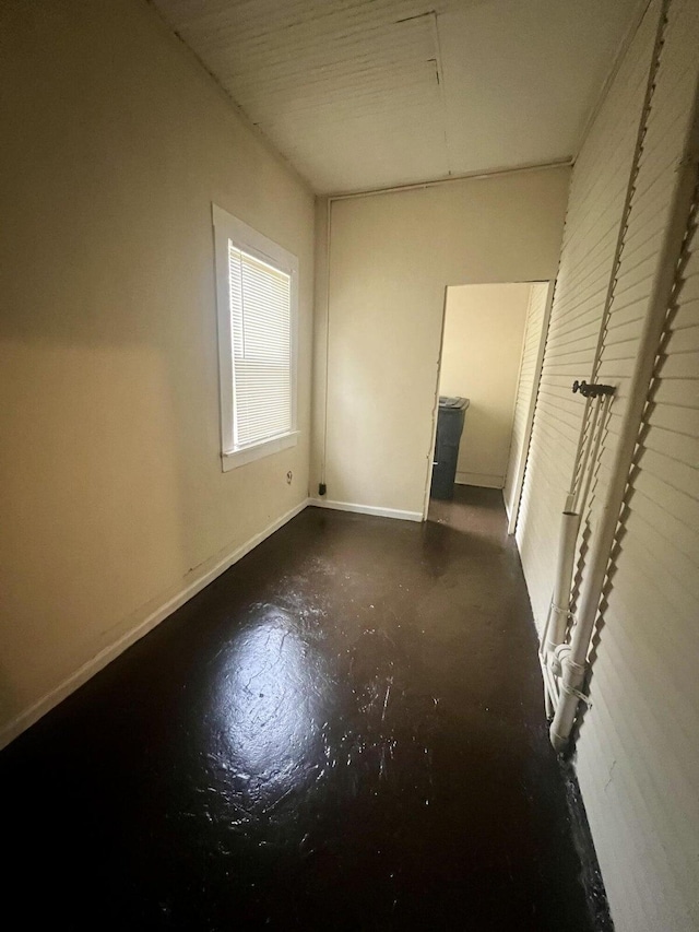 535 Madison Ave NW, Roanoke, VA 24016 - unfurnished bedroom featuring baseboards and concrete floors