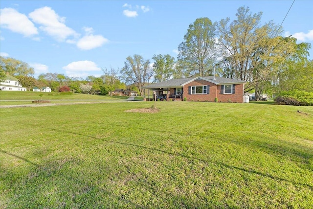 151 James River Ter, Buchanan, VA 24066 - view of front of house with brick siding, a front yard, and a chimney