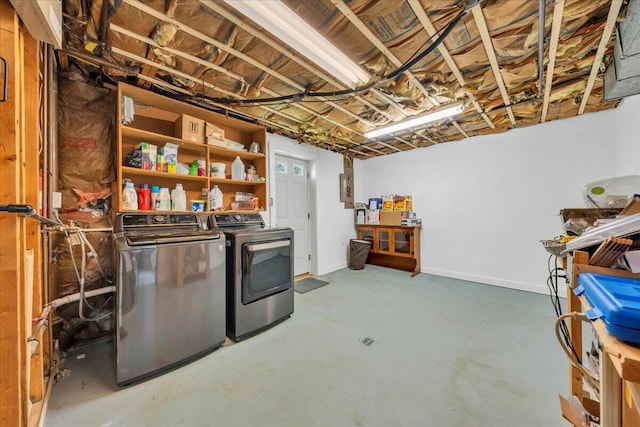 unfinished basement with baseboards and separate washer and dryer