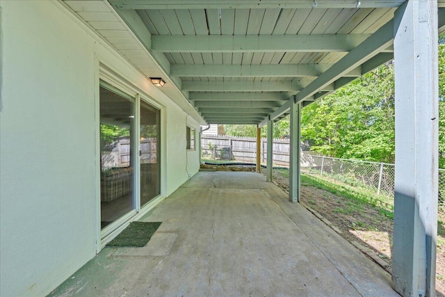 view of patio featuring fence