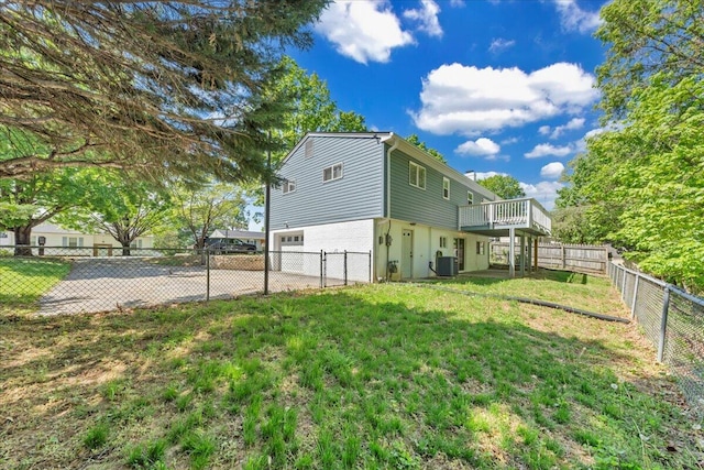 view of property exterior with a wooden deck, central air condition unit, a yard, and an attached garage