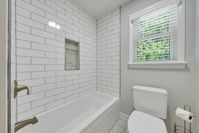 bathroom with toilet and baseboards