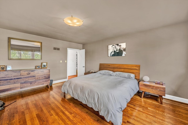 3421 Exeter St SW, Roanoke, VA 24014 - bedroom featuring baseboards, wood finished floors, and visible vents