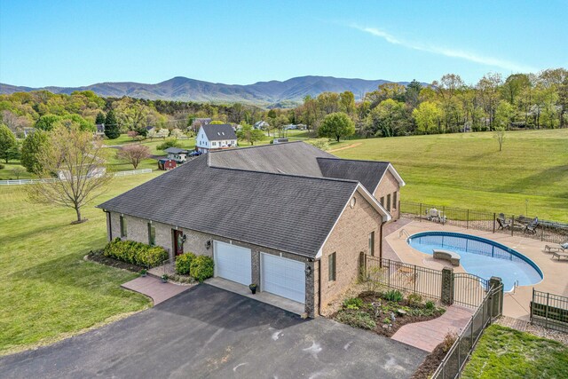 birds eye view of property with a mountain view