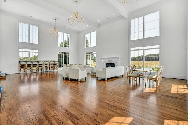 189 Old Buckingham Rd, Cumberland, VA 23040 - living room with a chandelier, a high ceiling, a fireplace, wood finished floors, and beam ceiling