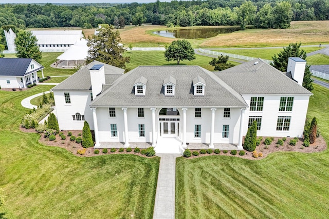 189 Old Buckingham Rd, Cumberland, VA 23040 - view of front facade with a chimney, a water view, stucco siding, and a front yard