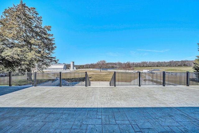 view of patio featuring fence