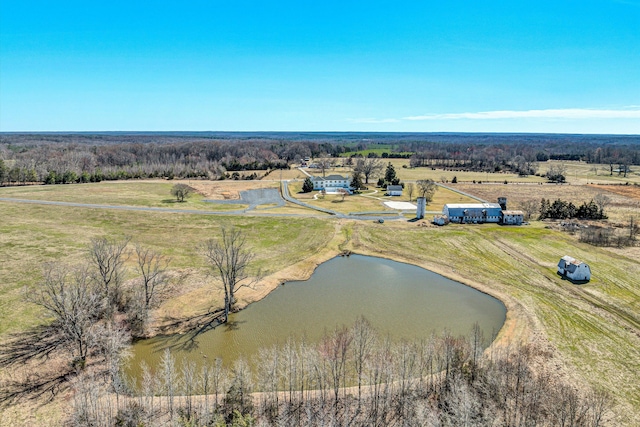 birds eye view of property with a rural view and a water view