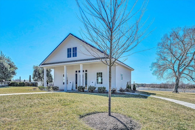 view of front of house with a porch and a front lawn