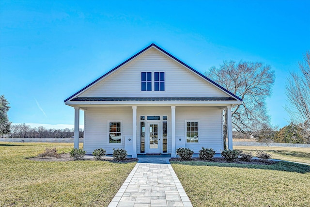 bungalow-style house featuring a porch and a front yard