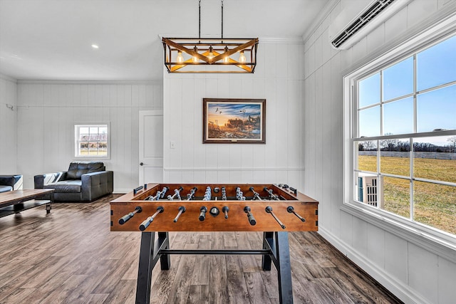 189 Old Buckingham Rd, Cumberland, VA 23040 - game room with ornamental molding, healthy amount of natural light, wood finished floors, a chandelier, and an AC wall unit