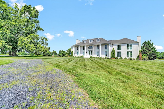 189 Old Buckingham Rd, Cumberland, VA 23040 - greek revival house featuring a chimney and a front lawn
