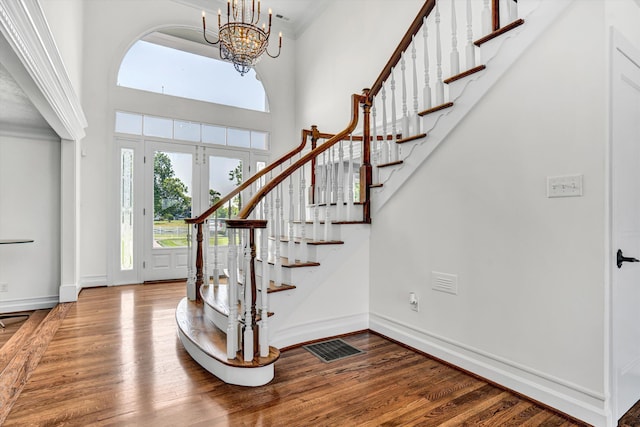189 Old Buckingham Rd, Cumberland, VA 23040 - foyer entrance with wood finished floors, stairway, a chandelier, and a towering ceiling