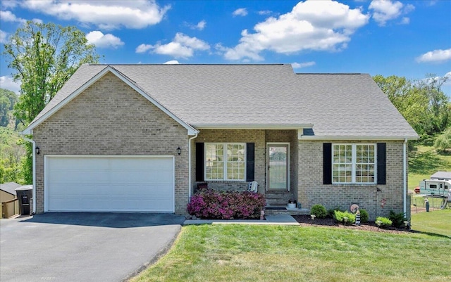 3609 Carson Rd, Roanoke, VA 24012 - ranch-style home featuring a front yard, roof with shingles, brick siding, an attached garage, and driveway