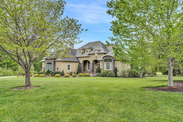 135 Bentgrass Dr, Hardy, VA 24101 - french country style house with stone siding, a chimney, a front lawn, and stucco siding