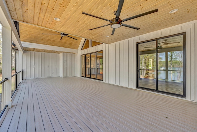 wooden deck featuring a water view and ceiling fan