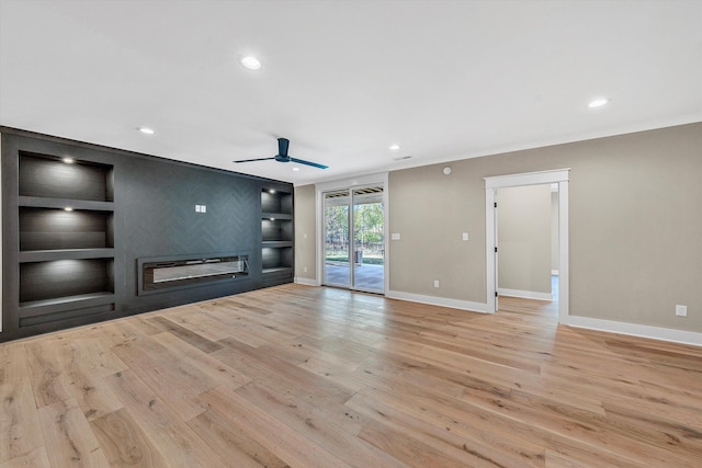 unfurnished living room with baseboards, a ceiling fan, wood finished floors, and recessed lighting
