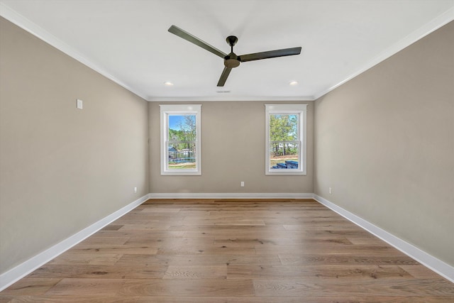 unfurnished room featuring plenty of natural light, ornamental molding, light wood-style floors, and ceiling fan