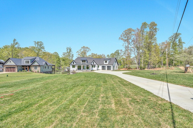view of front of house featuring a front yard and concrete driveway