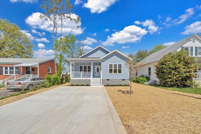 bungalow-style home with a porch and crawl space
