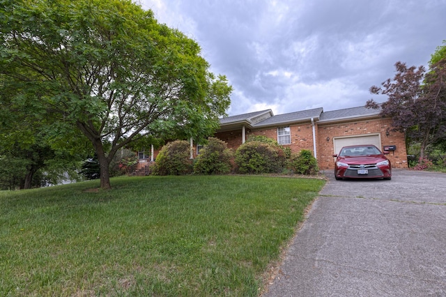 1615 Deyerle Rd SW, Roanoke, VA 24015 - view of front of home with brick siding, asphalt driveway, a garage, and a front yard