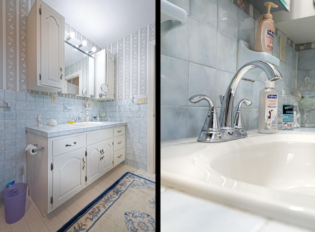 1615 Deyerle Rd SW, Roanoke, VA 24015 - bathroom featuring wallpapered walls, tile walls, tile patterned flooring, vanity, and wainscoting