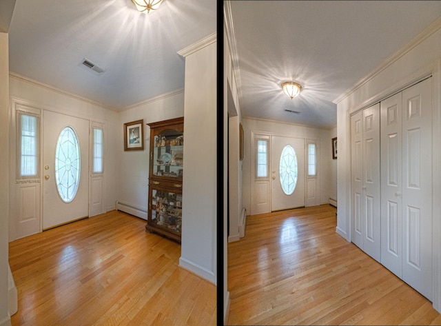 1615 Deyerle Rd SW, Roanoke, VA 24015 - foyer entrance with baseboard heating, ornamental molding, light wood finished floors, and a baseboard heating unit
