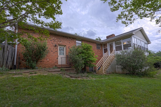 1615 Deyerle Rd SW, Roanoke, VA 24015 - rear view of house with brick siding, a sunroom, a chimney, and stairway