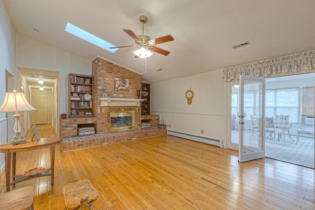1615 Deyerle Rd SW, Roanoke, VA 24015 - living area with a baseboard radiator, hardwood / wood-style floors, ceiling fan, vaulted ceiling, and a fireplace