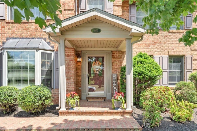 property entrance with brick siding