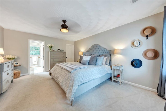 bedroom featuring baseboards, ceiling fan, and light carpet