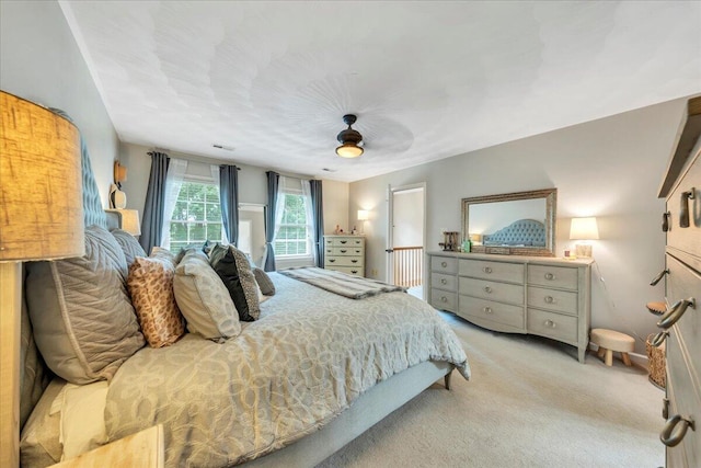 carpeted bedroom with a ceiling fan