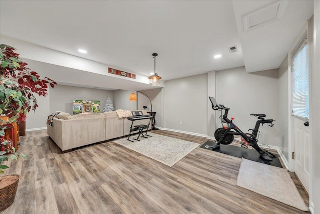 workout room with recessed lighting, baseboards, visible vents, and wood finished floors