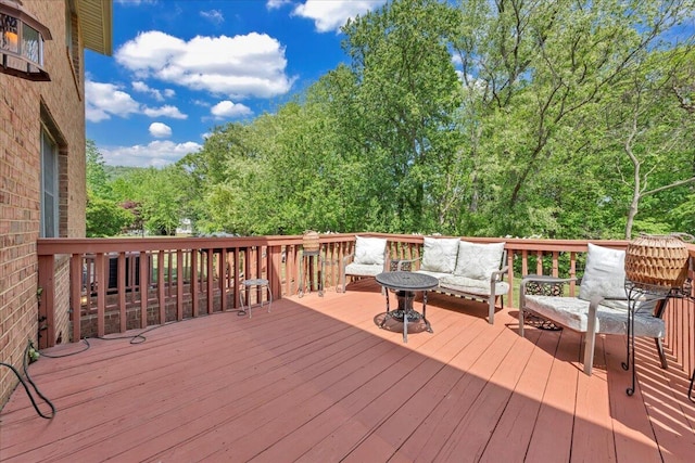 wooden deck with an outdoor hangout area