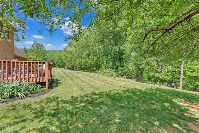 view of yard with a wooden deck
