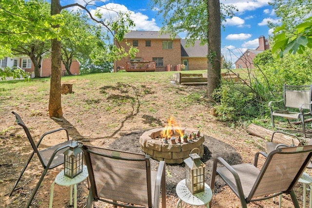 view of yard featuring an outdoor fire pit