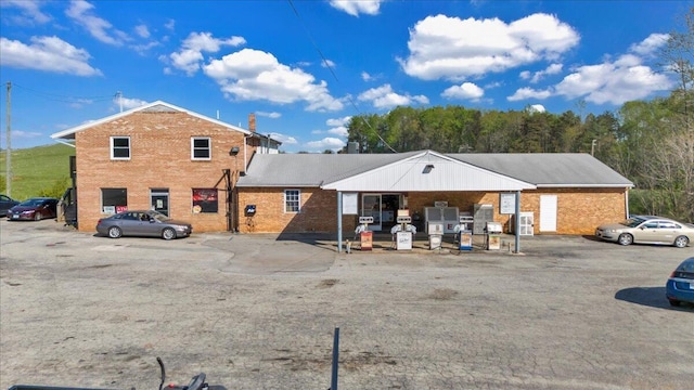 14189 Franklin St, Ferrum, VA 24088 - rear view of house with uncovered parking and brick siding