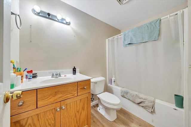14189 Franklin St, Ferrum, VA 24088 - full bath with vanity, toilet, shower / tub combo with curtain, and wood finished floors