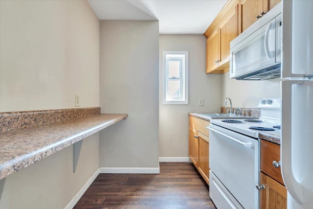 14189 Franklin St, Ferrum, VA 24088 - kitchen featuring a sink, white appliances, light countertops, baseboards, and dark wood-style flooring