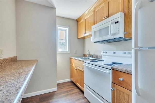 14189 Franklin St, Ferrum, VA 24088 - kitchen with dark wood-style floors, light countertops, a sink, white appliances, and baseboards