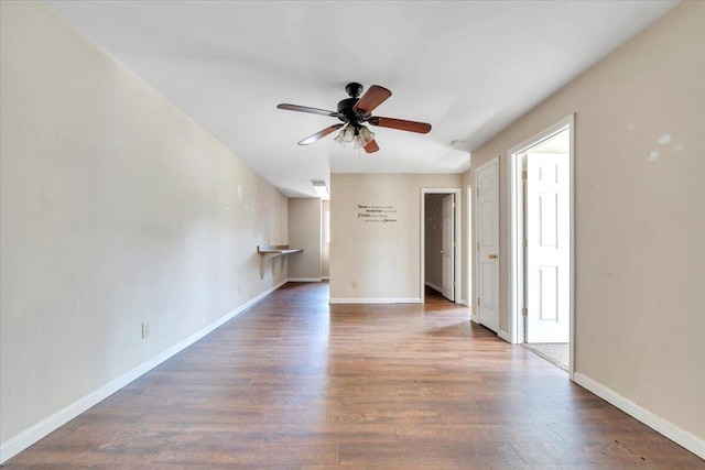 14189 Franklin St, Ferrum, VA 24088 - unfurnished room featuring vaulted ceiling, baseboards, a ceiling fan, and wood finished floors