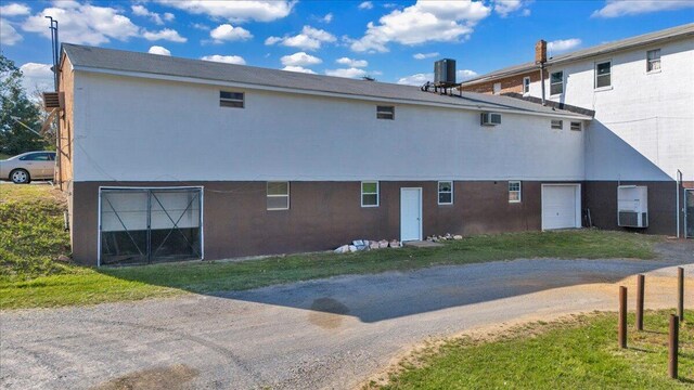14189 Franklin St, Ferrum, VA 24088 - back of property with central air condition unit, driveway, and a garage